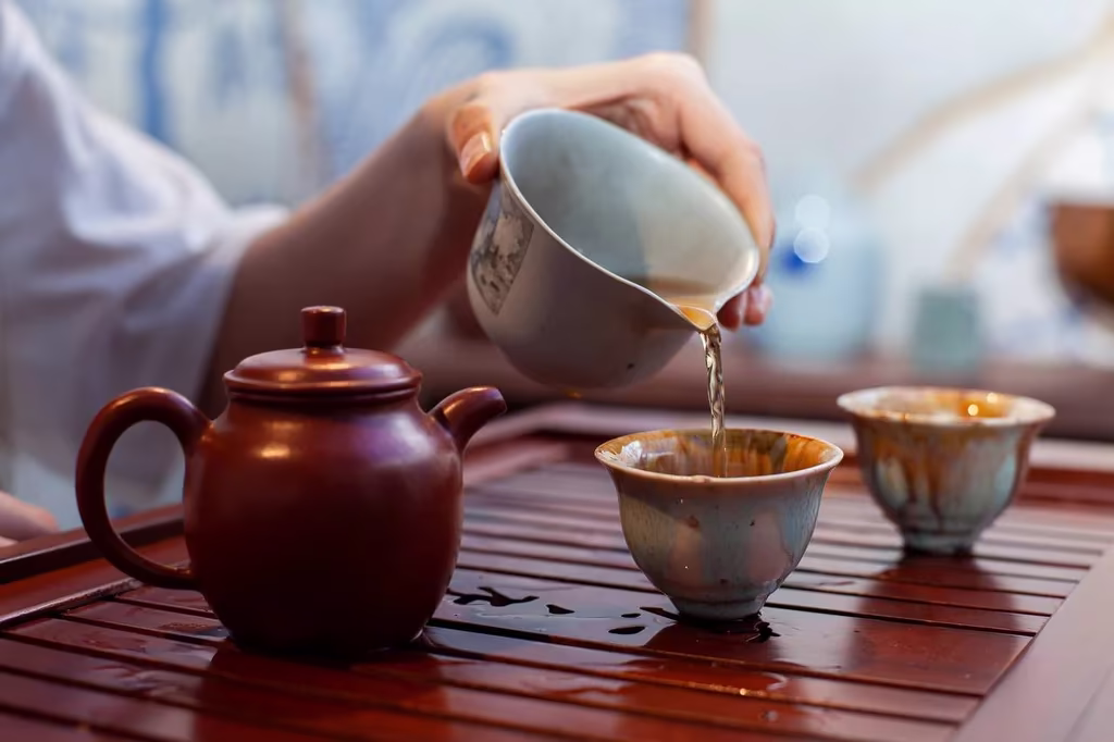 Traditional gongfu tea setup with small teapot and cups