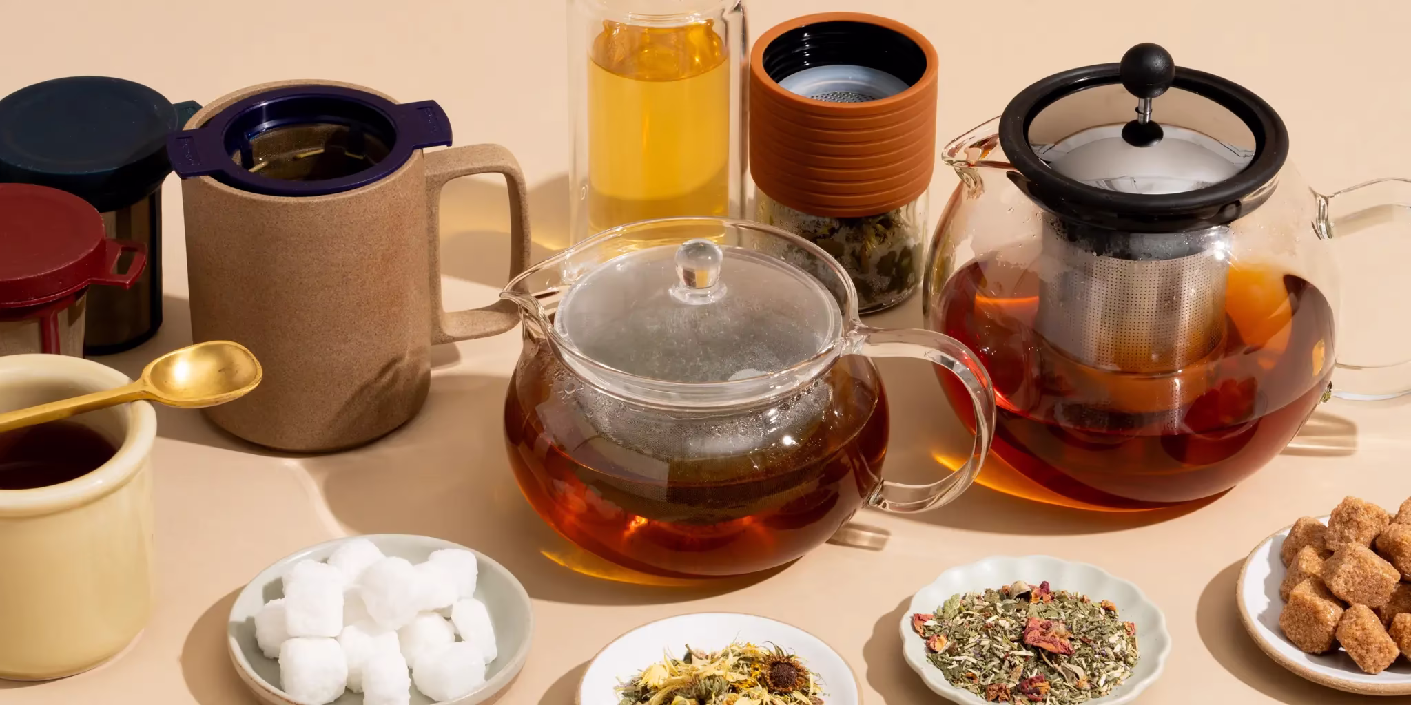 A large teapot next to a small gongfu tea setup
