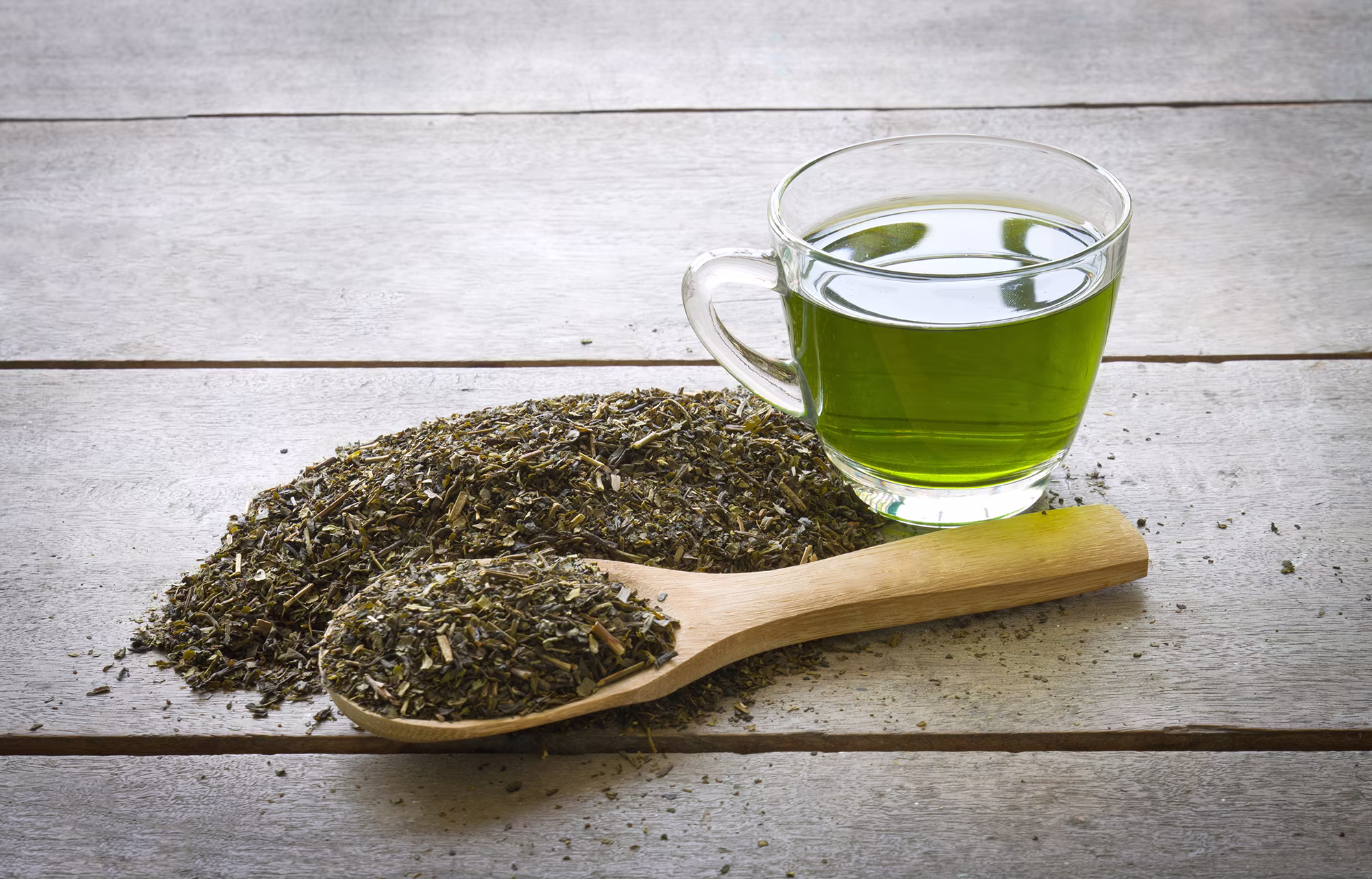 Japanese green tea leaves in a ceramic bowl